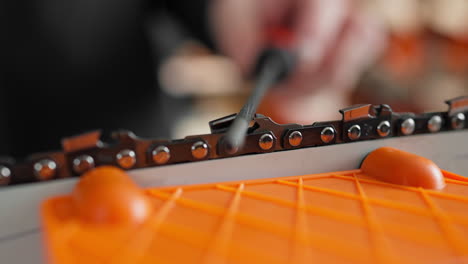 Sharpening-a-chainsaw-chain-in-30-degree-angle-close-up