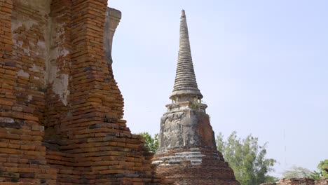slider reveal over stone pagoda at buddhist temple in thailand