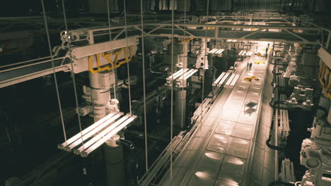 industrial facility interior with pipelines and machinery at night