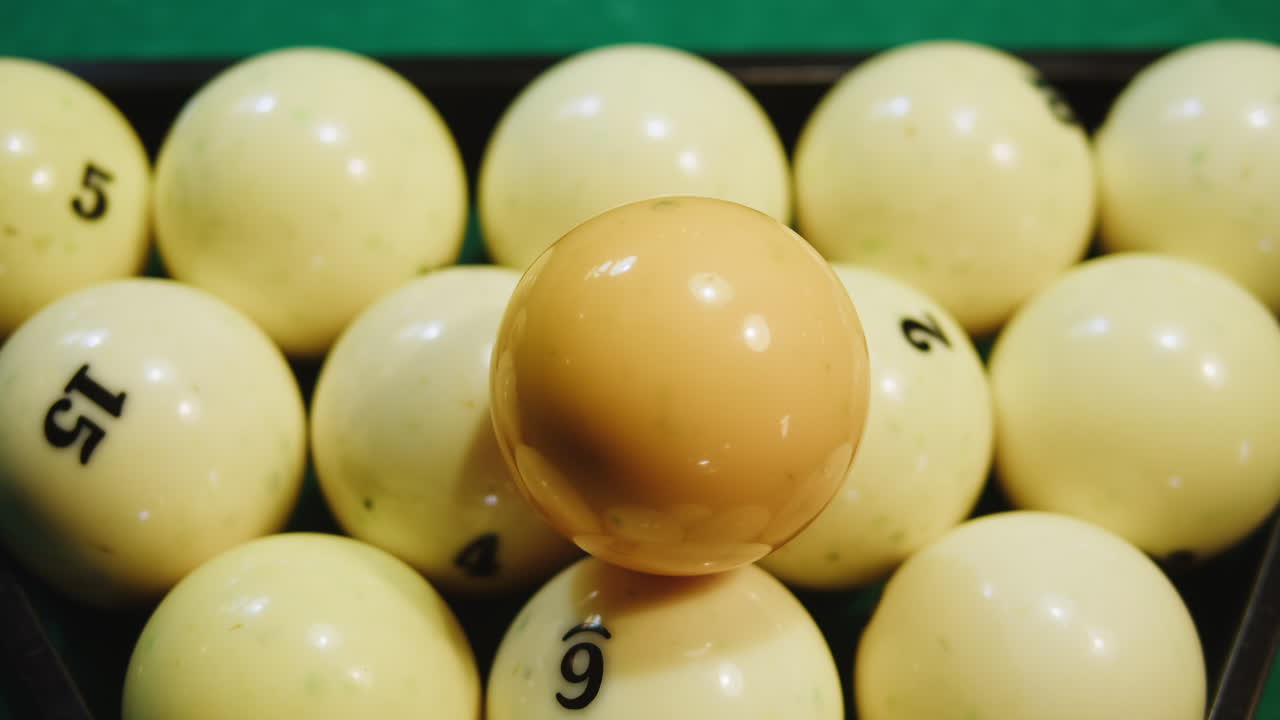 Pool Balls in a Triangle on a Green Table