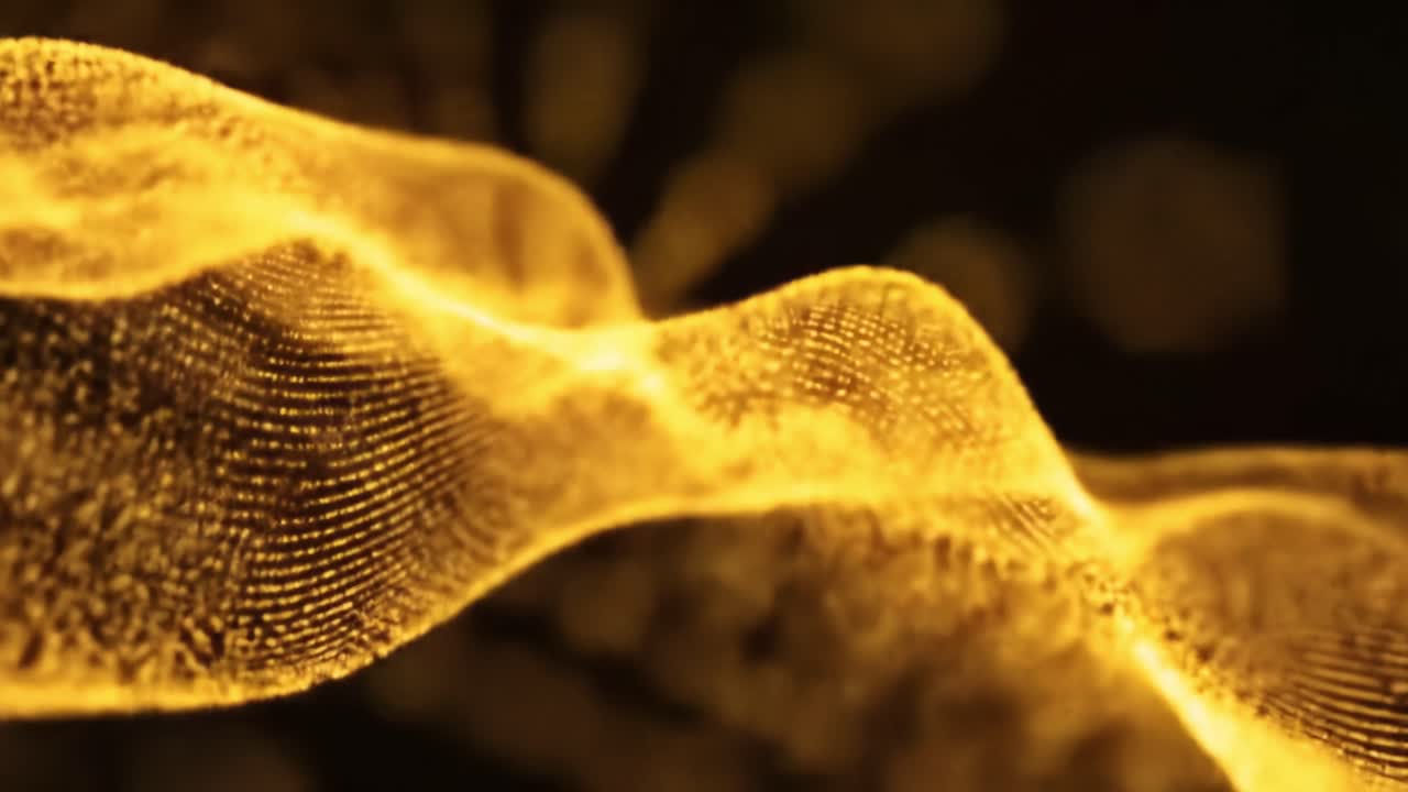 Intricate golden wave patterns flow gracefully across a dark backdrop, displaying captivating textures and shapes. The visual experience immerses viewers in a realm of abstract art.