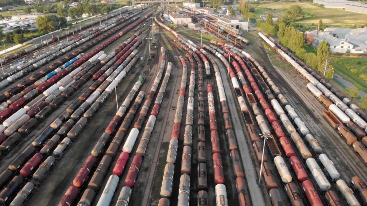 Aerial shot Showing Large Train Depot With Many colorful cargo Trains
