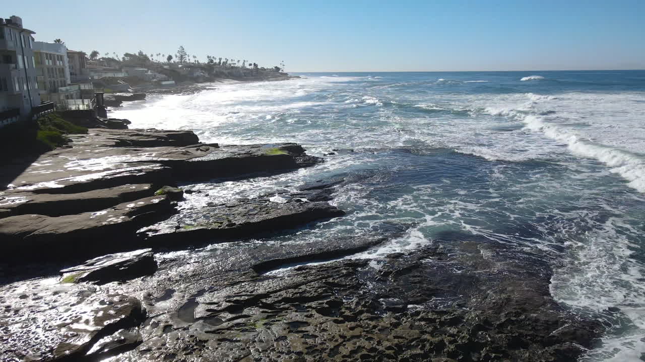 Aerial View of Stunning Ocean Coastline with Waves Crashing on Rocks