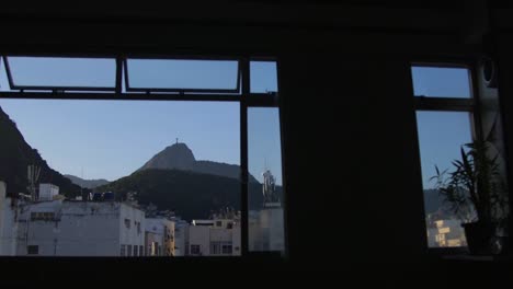 Evening-window-view-of-Christ-the-redeemer-in-Rio-de-Janeiro,-Brazil