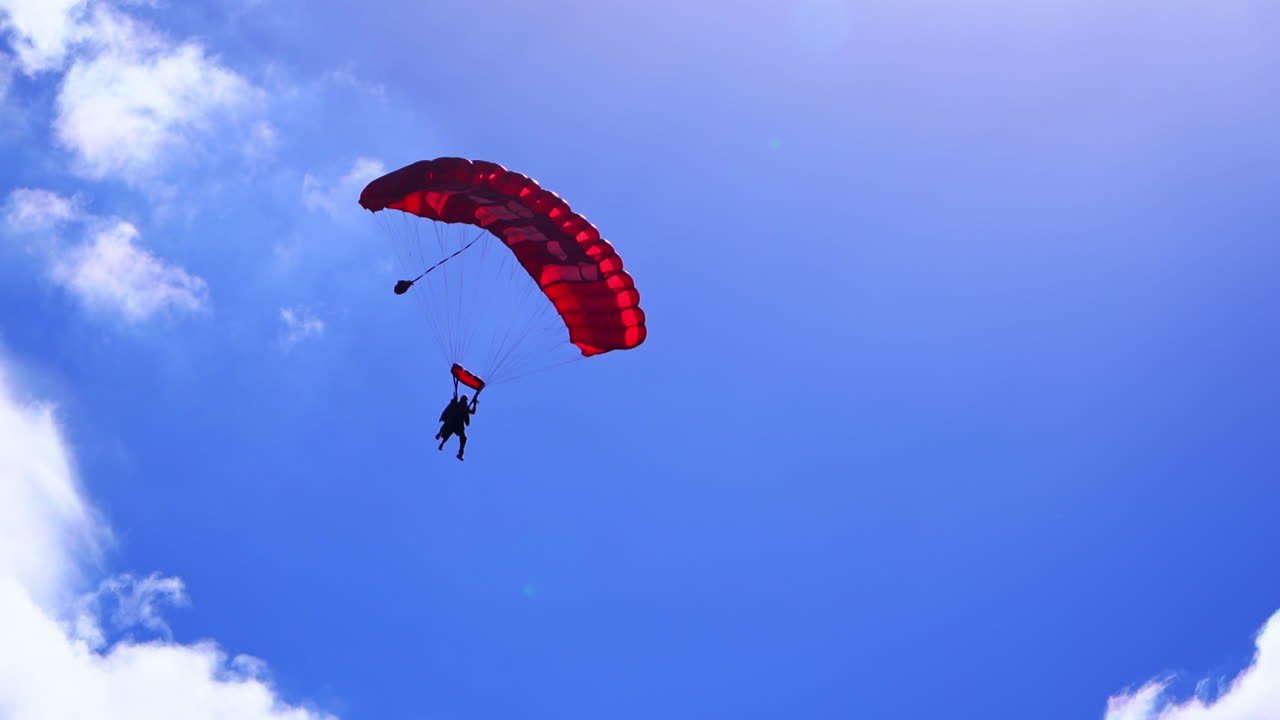 Skydiver with Red Parachute