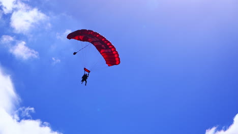 skydiver with red parachute
