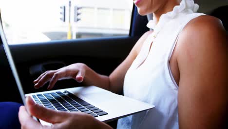 businesswoman using laptop