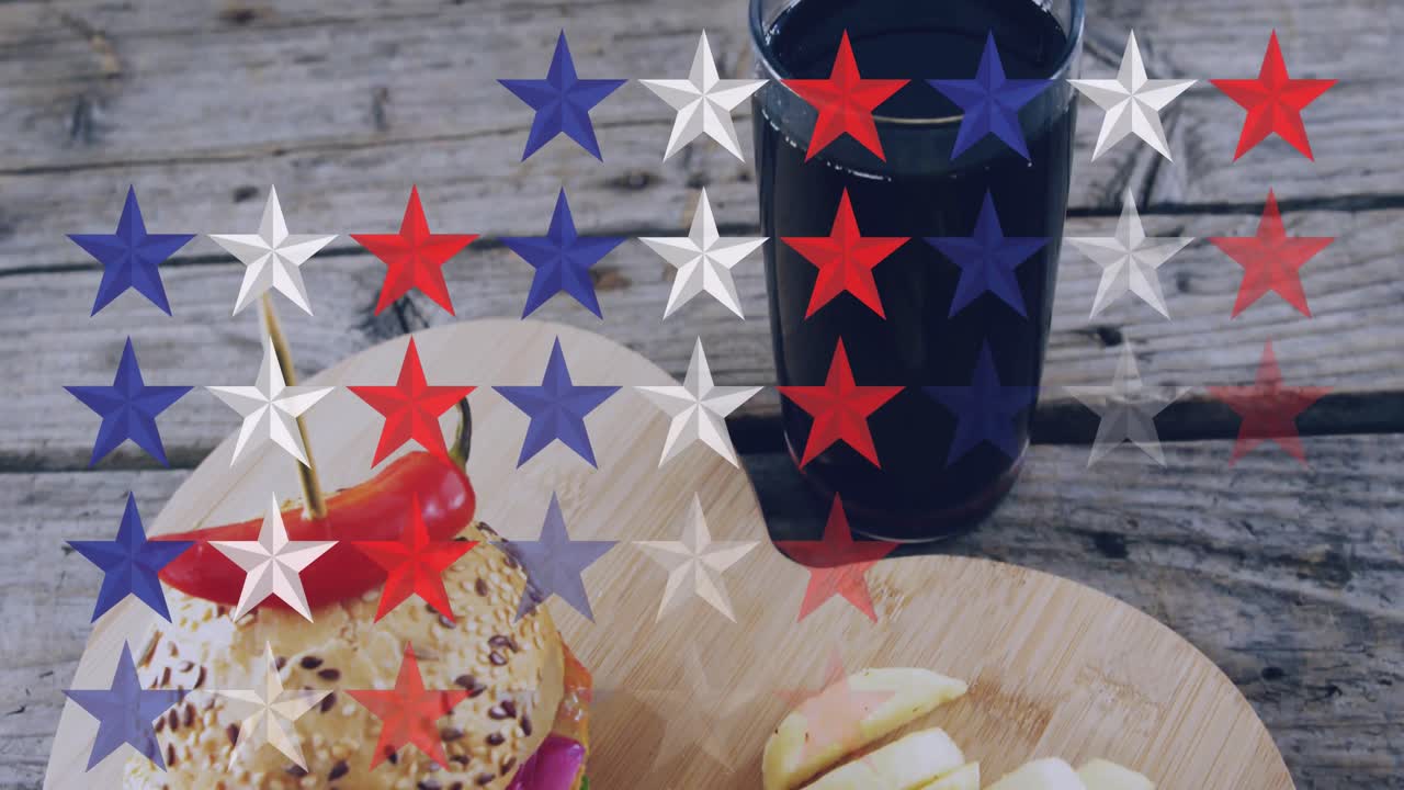 나무 테이블에 버거와 음료를 통해 별의 애니메이션