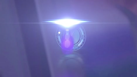 animation of clock with fast moving hands and light with lens flare over blurred background