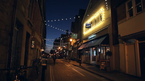 view along street in oxford city centre at dusk