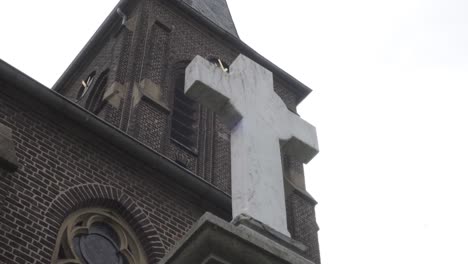 footage of a cross in front of a church in germany