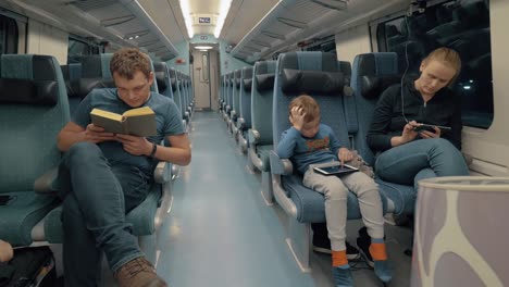 everyone in the family doing his own thing during train travel