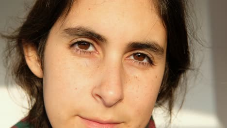 close up portrait of beautiful brunette young woman with brown eyes