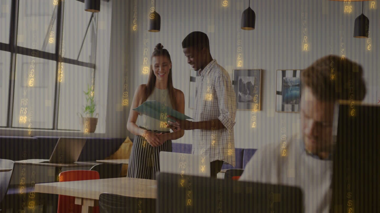 Reviewing documents, two colleagues in office with financial data animation overlay