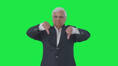 Angry-Indian-senior-journalist-showing-thumbs-down-Green-screen