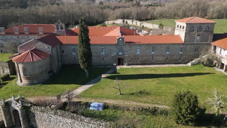 aerial pullback from entrance path and courtyard at monastery in ourense