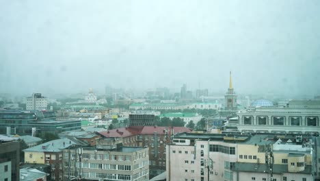 rainy city view through a window