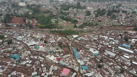 Aerial-view-of-biggest-urban-slum-in-Africa-in-Kibera,-suburbia-of-Nairobi-Kenya