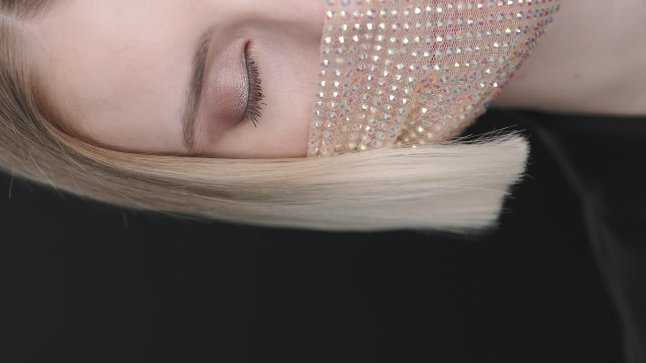 Woman in Stylish Face Mask Gazing at Camera