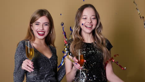 two women celebrating with champagne