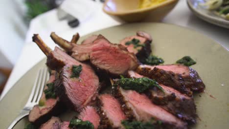 fine dining plate of lamb chops with wide angle pull back movement