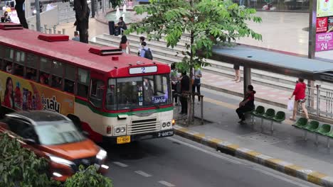 passengers boarding and alighting a city bus