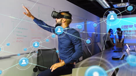 Animation of networks of connections and businessman wearing phone vr headset