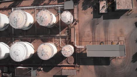 gas tanks refinery equipment. huge industrial complex with gas and fuel tanks. refinery plant territory. liquefied petroleum gas tanks. oil storage tanks in fuel refinery