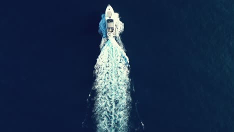 overhead shot of yacht sailing through a calm sea on a summer day on vacation