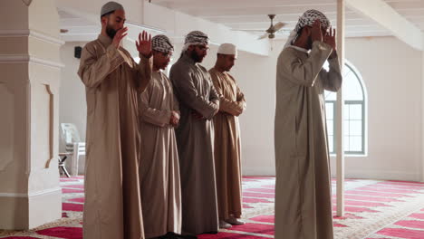 muslim men praying in a mosque