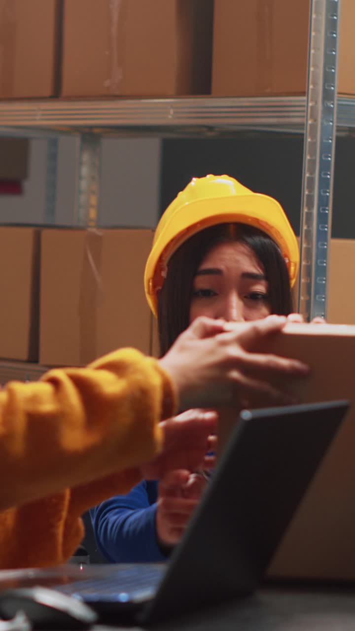 Vertical video: Young woman with disability working with supply chain