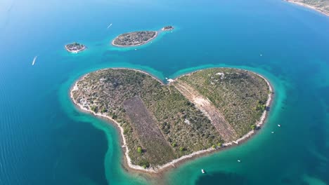 aerial view of the beautiful galešnjak, island of love, lover's island, otok za zaljubljene, love island, heart shaped island in the adriatic sea in croatia