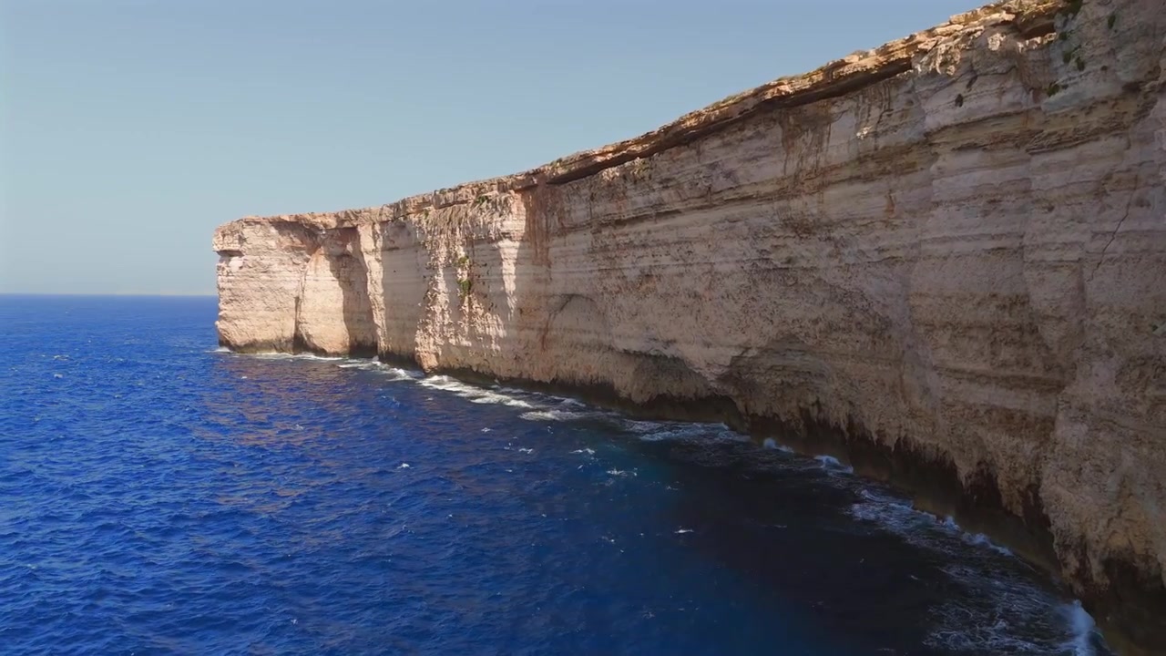 Join us on a drone journey over Malta’s cliffs, showcasing the vibrant turquoise waters and rugged landscapes that make this Mediterranean gem a must-see destination.
