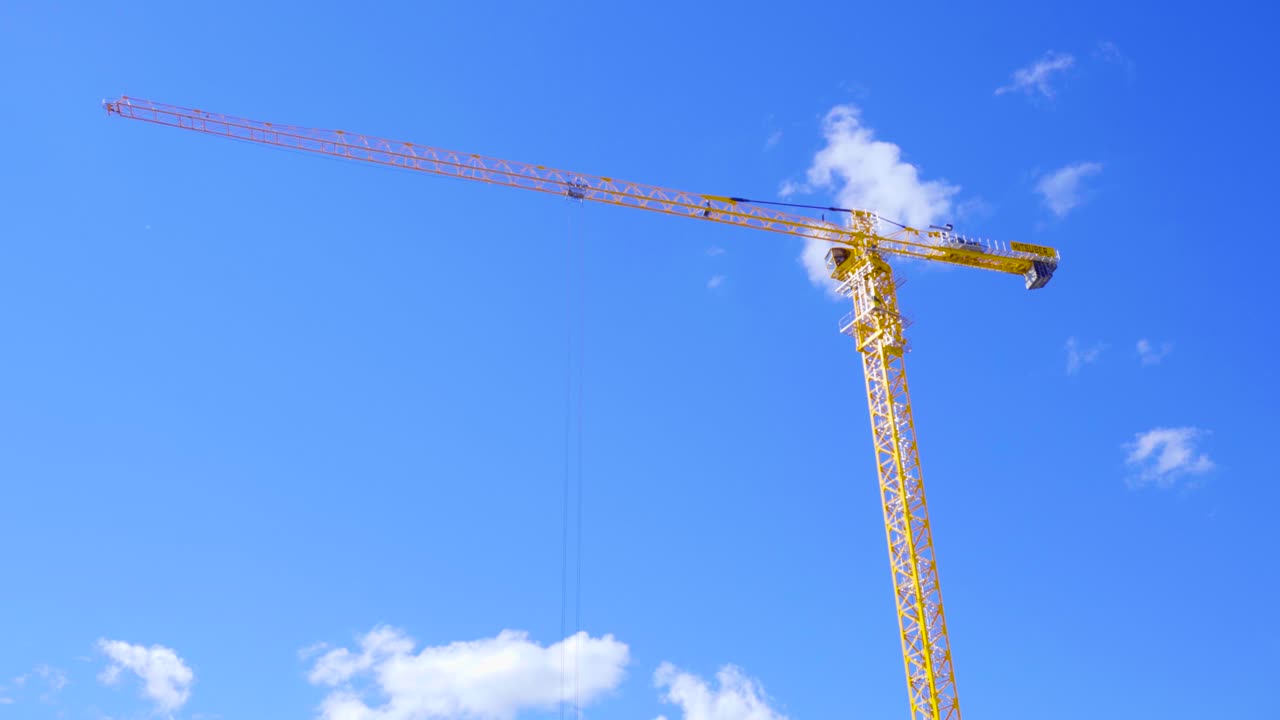 Yellow Crane Against a Blue Sky