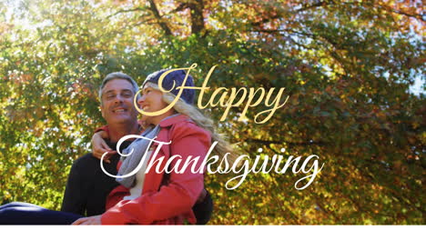 Happy-Thanksgiving-text-animation-over-couple-embracing-in-autumn-park