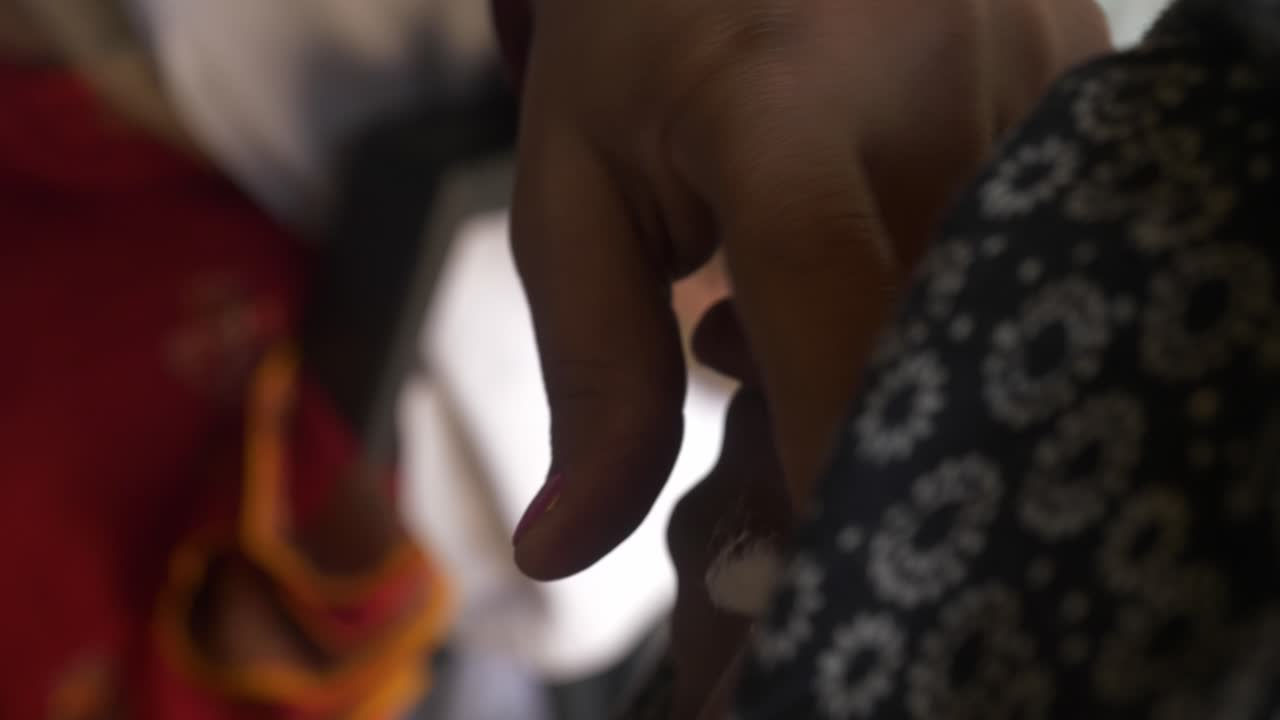 Social healthcare ASHA worker giving injection on arms of a pregnant woman during a maternal checkup in rural center, National Rural Health mission, Begusarai district, Bihar