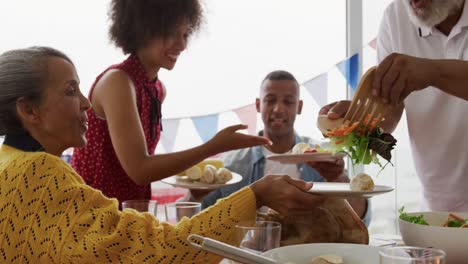 multi-generation family having celebration meal