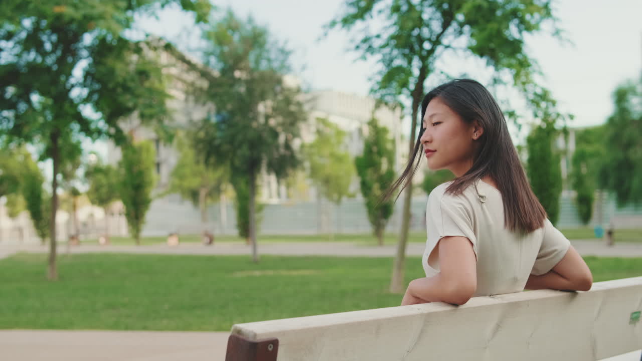 Woman Sitting on Park Bench