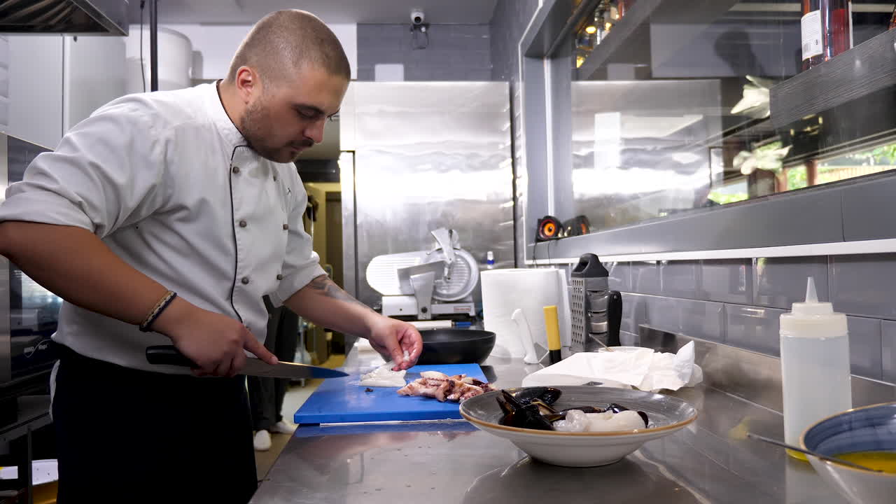 Chef Preparing Seafood in Restaurant Kitchen