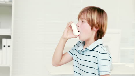 boy using inhaler