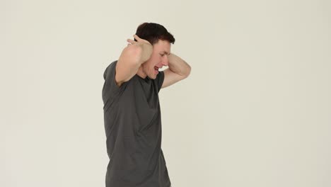 Man covering ears