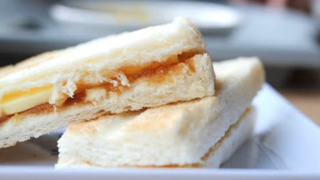 Kaya-toast-with-a-cup-of-tea-on-table-,