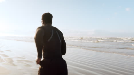 Man,-beach-and-running-in-fitness