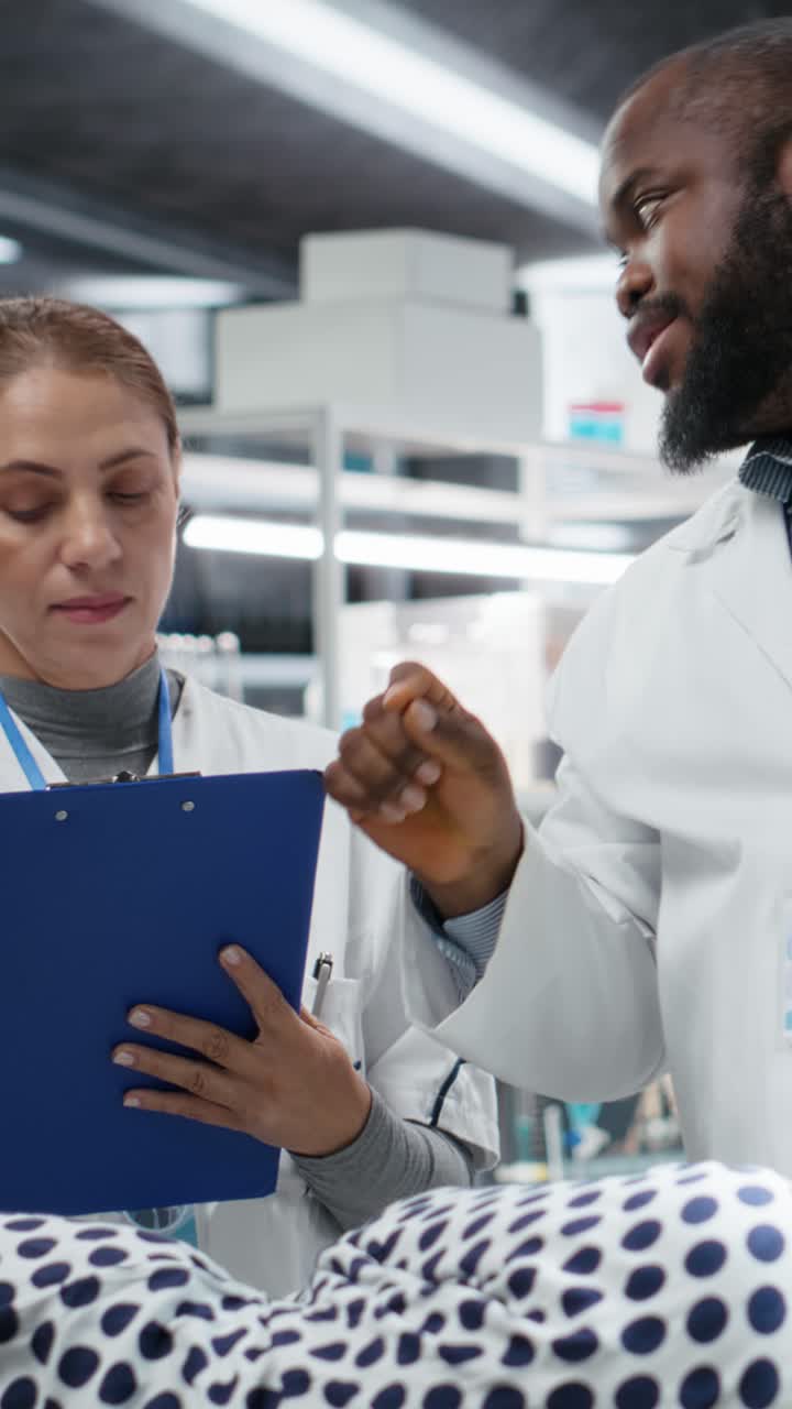 Vertical Video Professionals use magnifying glass to perform examination in a drug trial