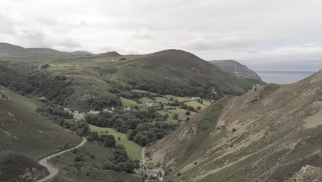 capelulo penmaenmawr welsh mountain coastal valley aerial pan left over ridge view north wales