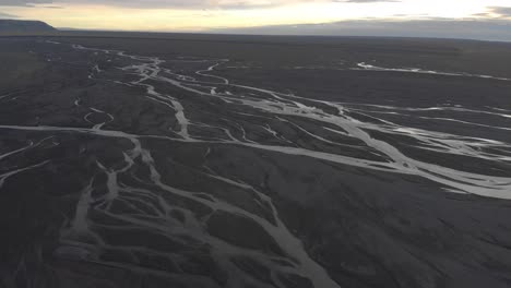 stunning aerial shot of glacial rivers in iceland