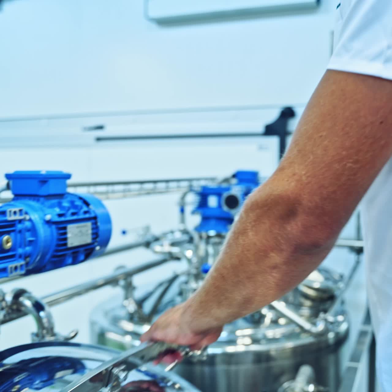 Worker on modern milk factory