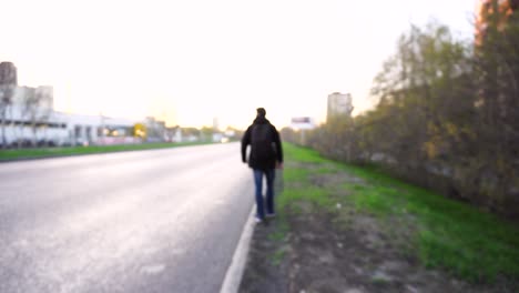 man walking down a city street