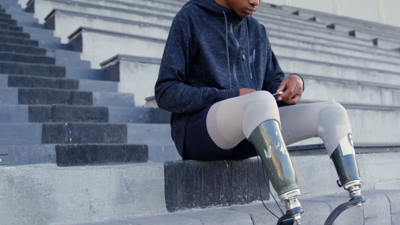 Disabled athletic listening music on mobile phone 4k