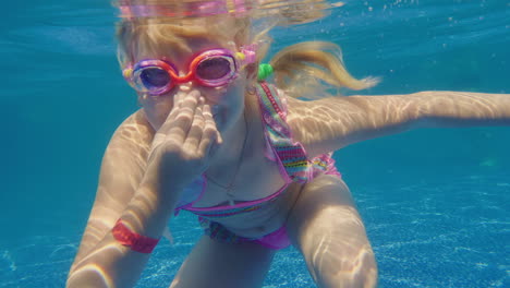 girl 6 years old learns to dive in the pool slow motion video